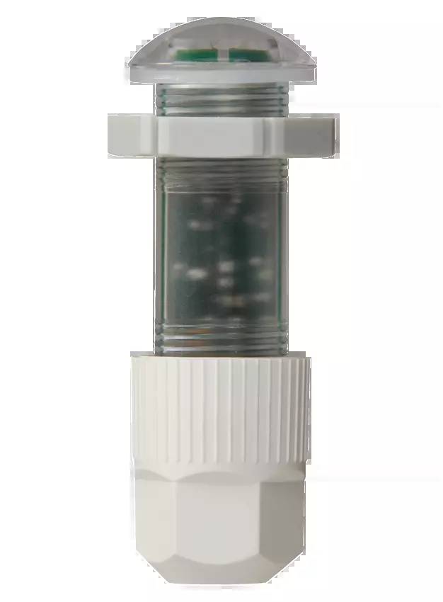 Biały cylinder plastikowy z przezroczystą środkową częścią, zawierającą kulki.