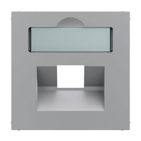 Szara, kwadratowa lampa z prostokątnym oknem świetlnym u góry i zakrzywonym otworem wylotowym u dołu. Nowoczesny, minimalistyczny design.