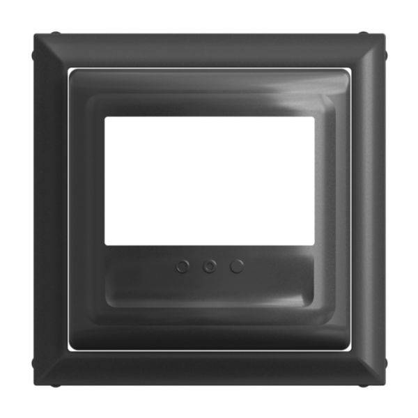 Czarny, kwadratowy ramka z prostokątnym otworem i trzema małymi, okrągłymi przyciskami na dolnej krawędzi.