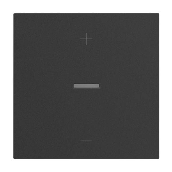 Kwadratowy, czarny włącznik światła z wąskim, poziomym srebrnym paskiem pośrodku oraz znakiem plus u góry.