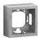 Szary, kwadratowy rama montażowa z otworami i punktami mocowania, odpowiedni do instalacji elektrycznych.