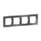 Poczwórna ramka w ciemnoszarym kolorze do włączników światła lub gniazd elektrycznych, prostokątna, ułożona poziomo.