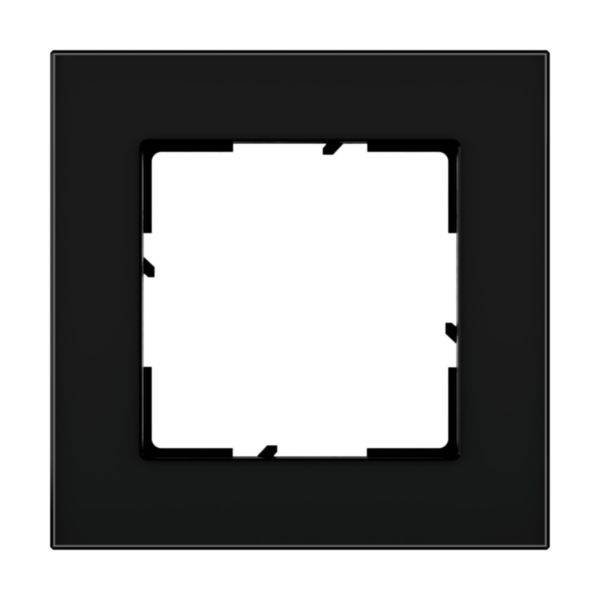 Czarny, kwadratowy ramka z białym, pustym wnętrzem kwadratu, odpowiednia do użycia jako osłona włącznika lub gniazda elektrycznego.