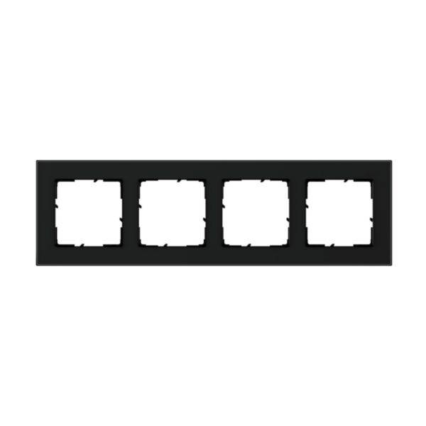 Czarny, poczwórny ramka na włączniki światła lub gniazdka elektryczne na białym tle.