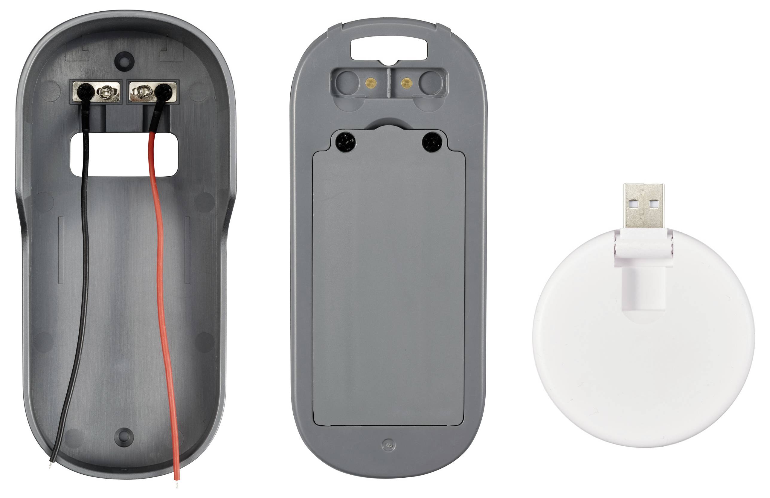 Rozłożony bezprzewodowy korpus myszy. Po lewej obudowa z kablami, po prawej tylna strona z pokrywą baterii i adapterem USB.