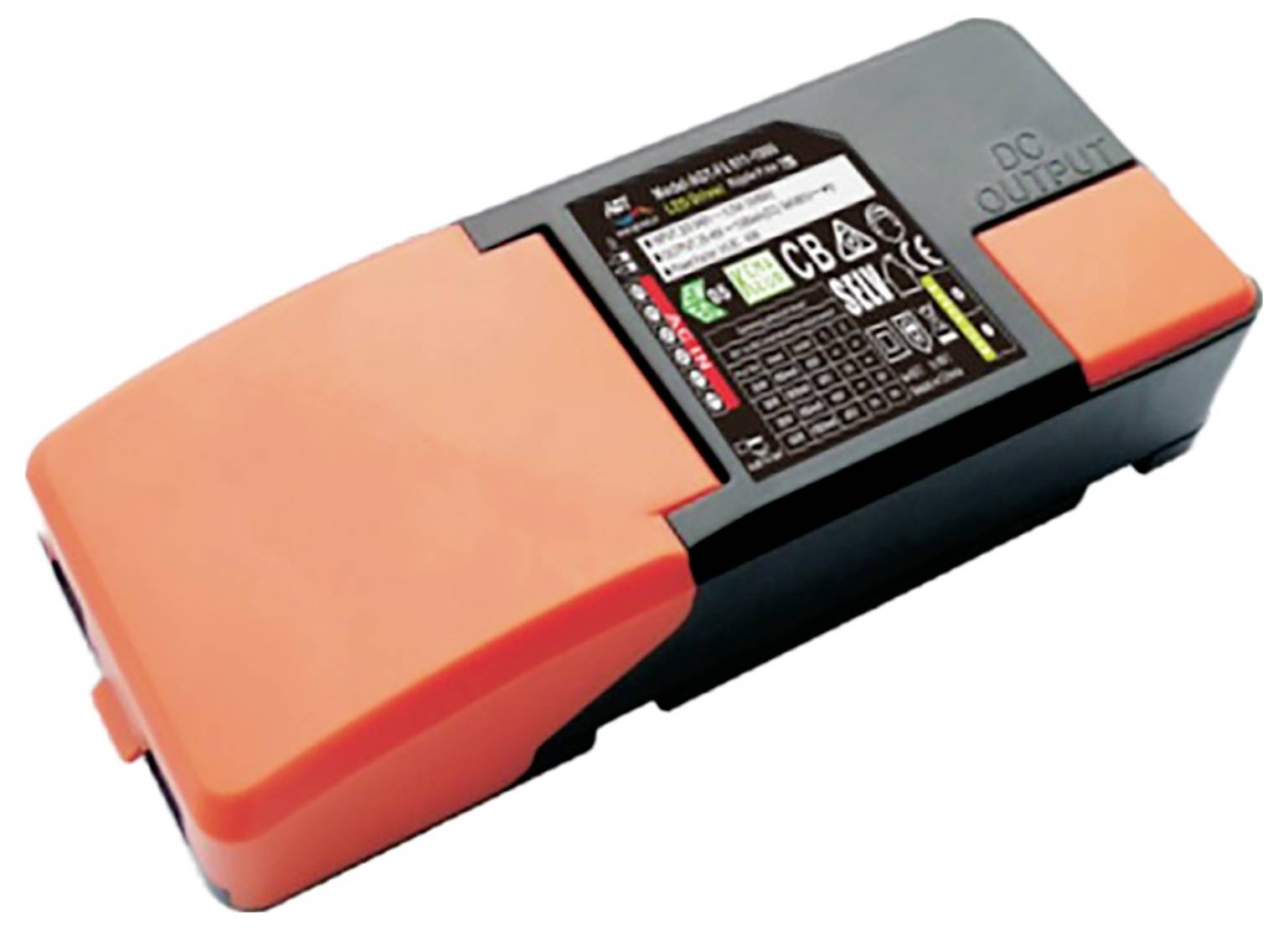 Adapter AC/DC z pomarańczową obudową, czarną częścią środkową oraz etykietą z parametrami technicznymi i symbolami.