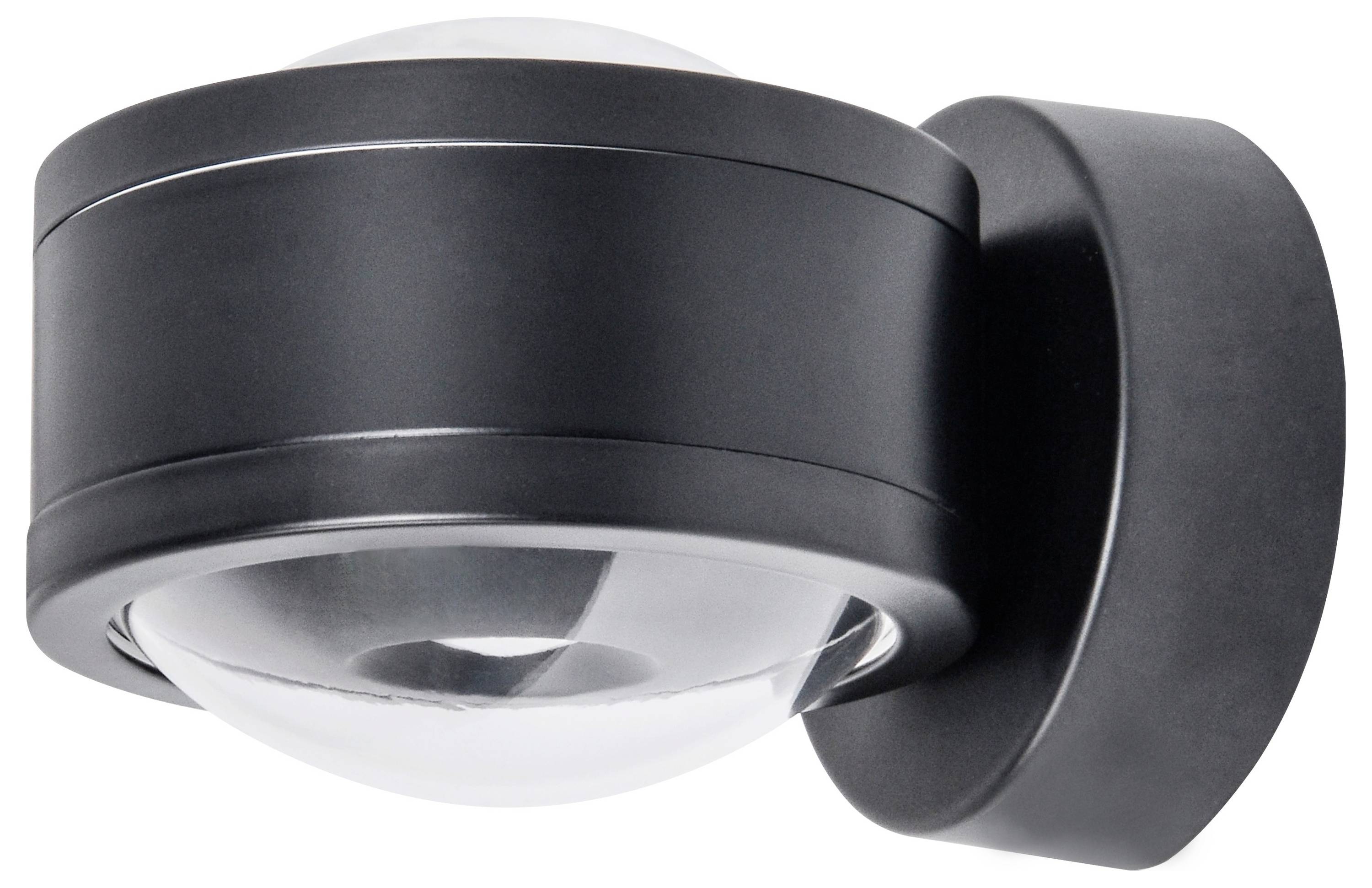 Czarny, okrągły czujnik ruchu zamontowany na ścianie. Główne cechy: wypukła bryła, odpowiedni do nadzoru bezpieczeństwa.