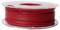 Szpula z czerwonym filamentem, prawdopodobnie do drukarki 3D, na przezroczystej plastikowej rolce.