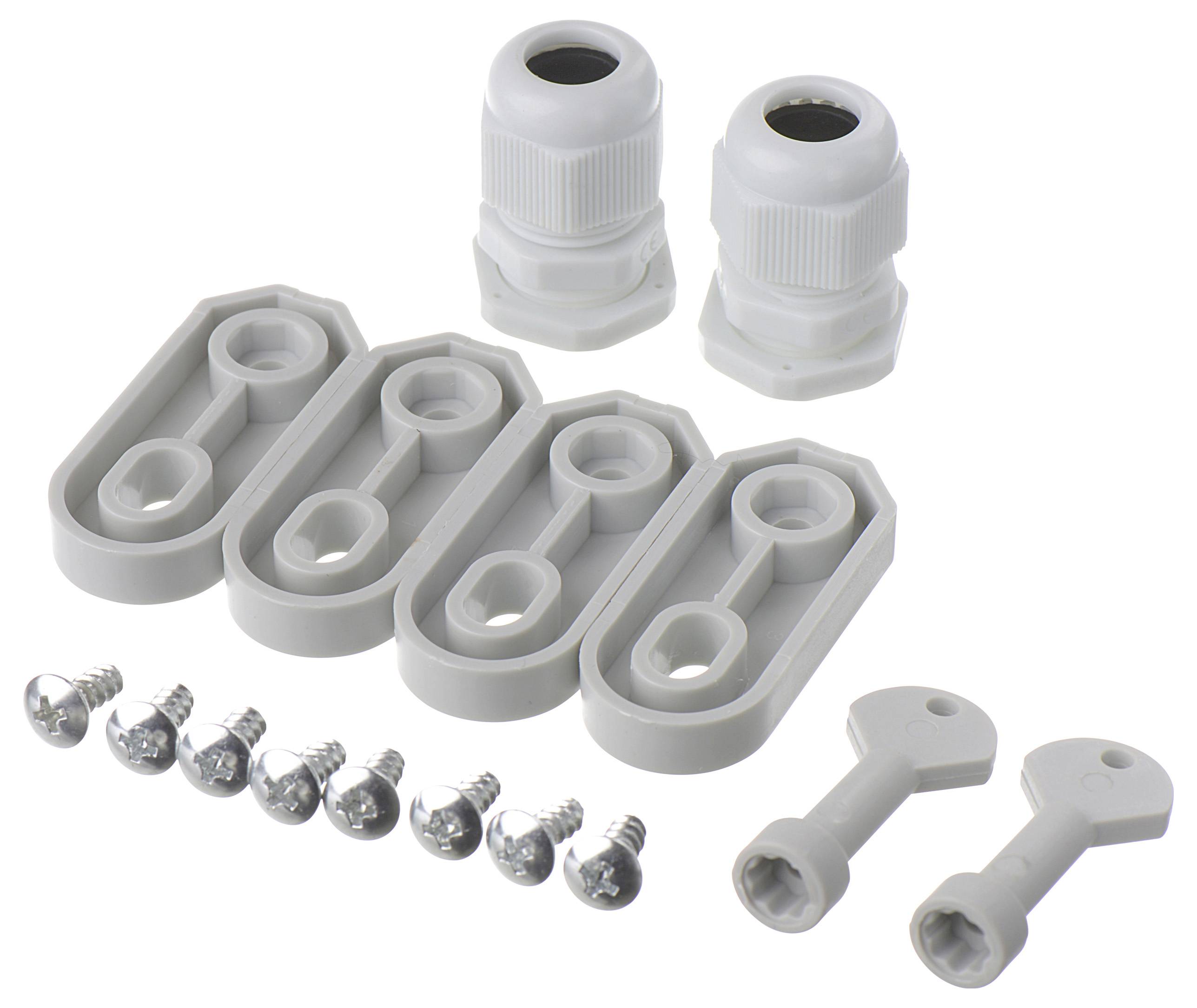 Różne plastikowe uchwyty kablowe, śruby i klucze do mocowania lub zabezpieczania połączeń kablowych na białej powierzchni.