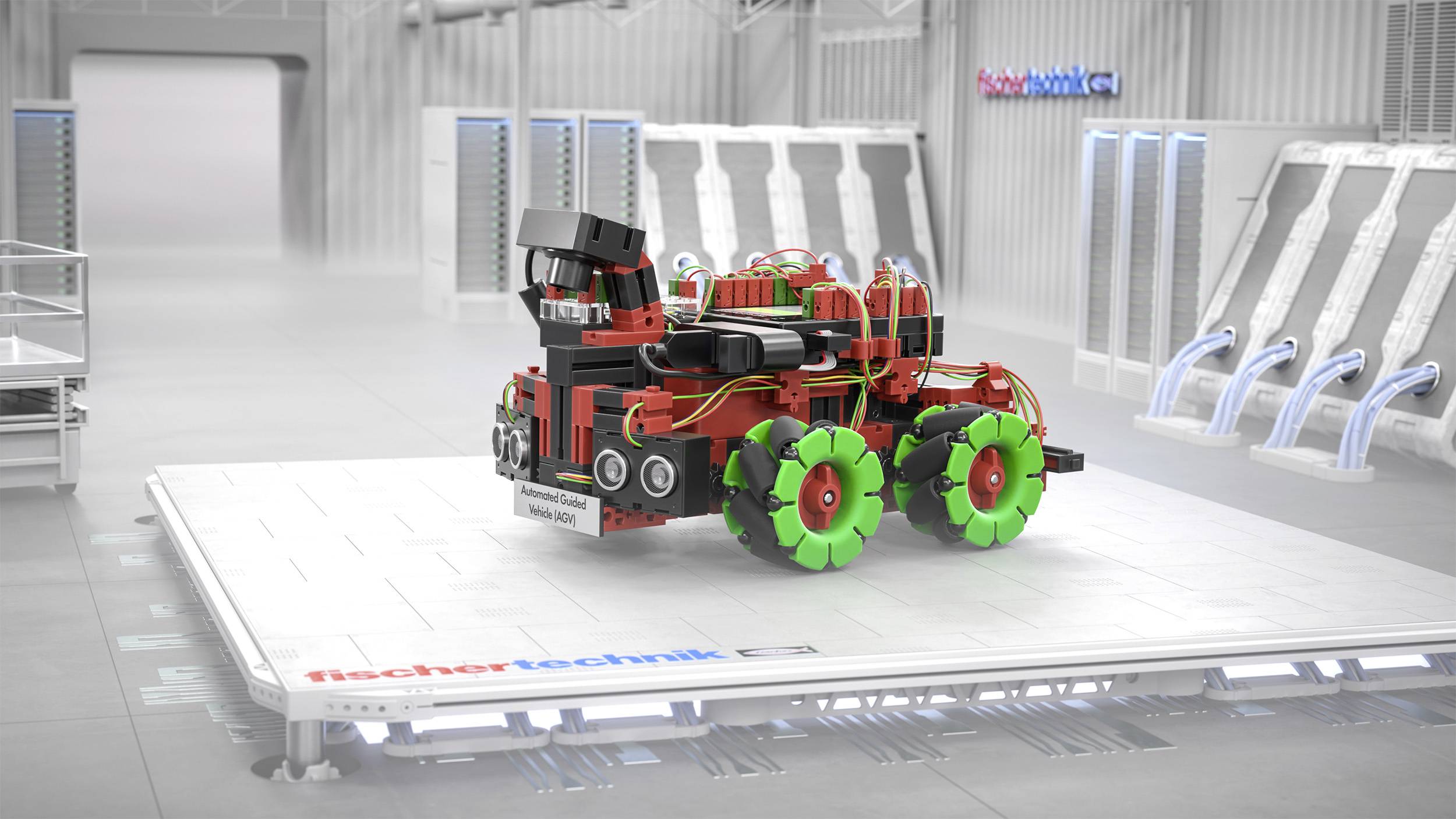 Futurystyczny model pojazdu zbudowany z kolorowych elementów stoi na podświetlonej platformie w wysoko zaawansowanym technicznie pomieszczeniu.