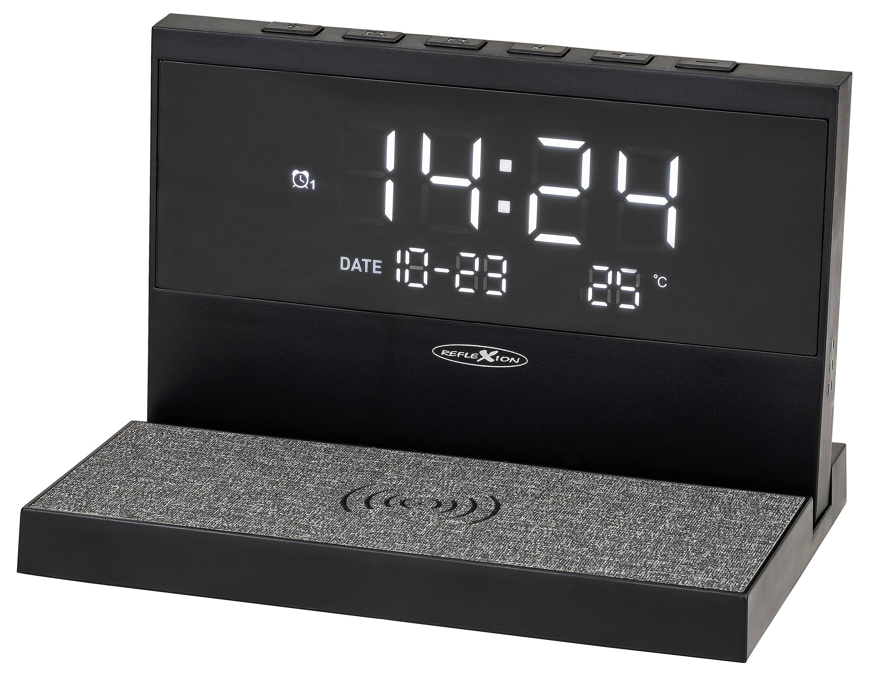 Cyfrowy budzik wyświetlający 14:24, datę 18-23 i 28°C, z bezprzewodową podstawką ładującą z przodu.