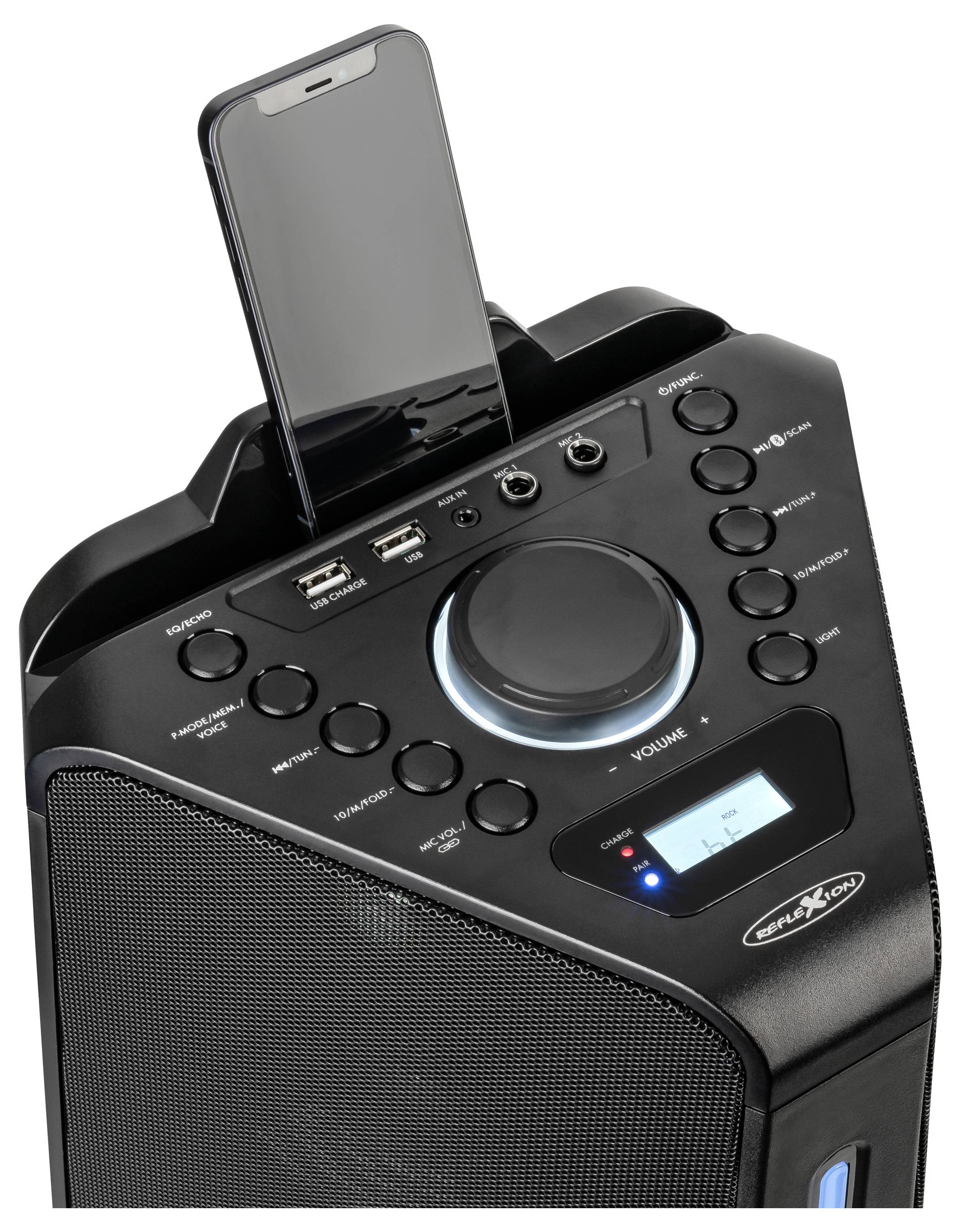 Czarna stacja dokująca dla głośnika ze smartfonem umieszczonym na górze, wyświetlająca duży pokrętło głośności, przyciski sterujące oraz mały panel wyświetlacza.