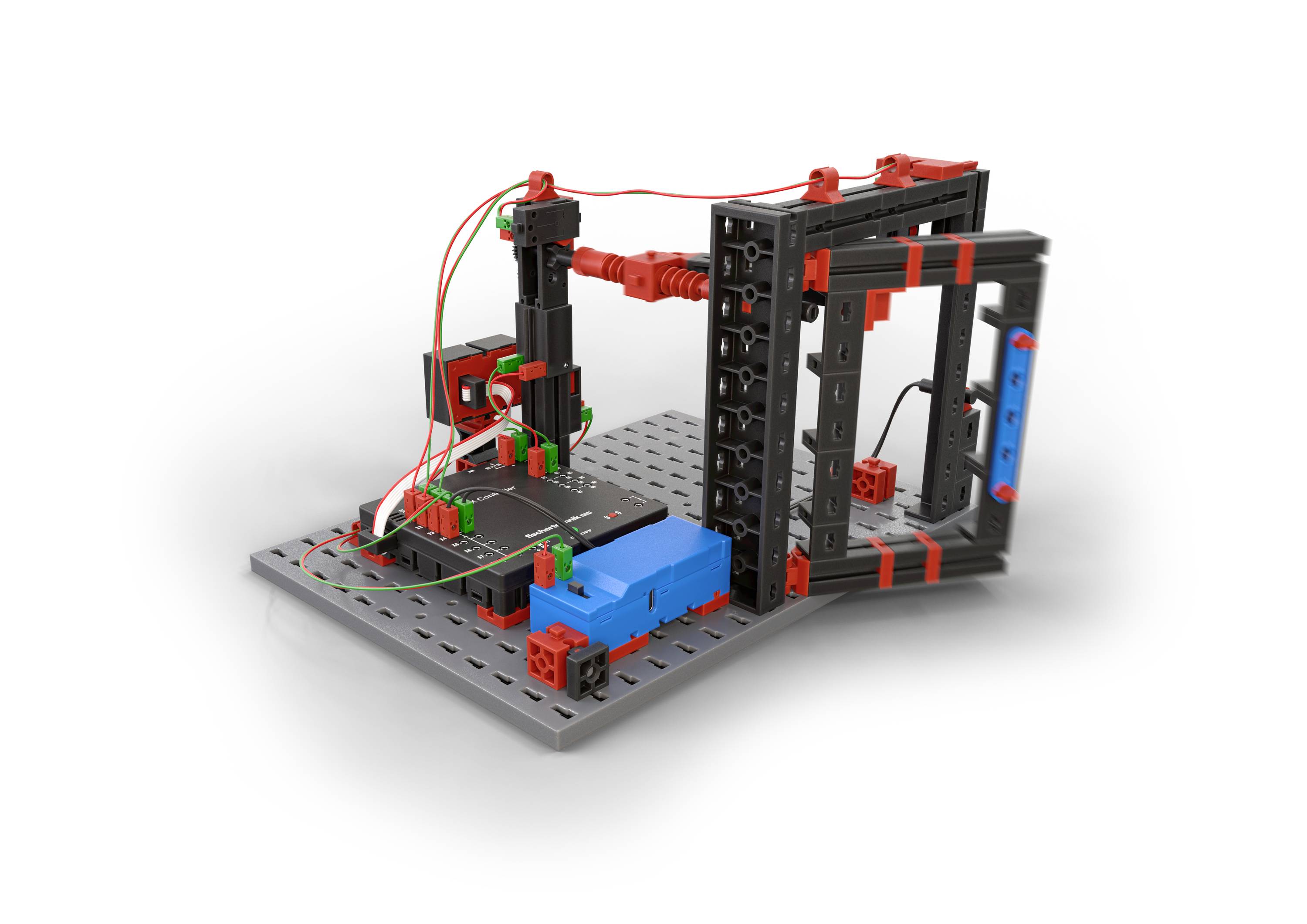 Modułowy robot zabawkowy składa się z kolorowych klocków i przewodów zamontowanych na szarej podstawie, przedstawiony bez konkretnej funkcji.