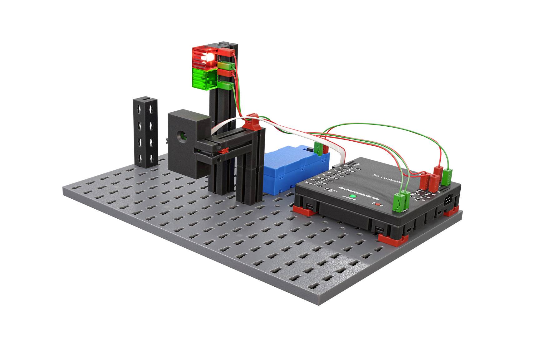Zestaw eksperymentalny na płycie, zawierający kolorowe moduły wtykowe i okablowanie, do demonstracji obwodów elektronicznych.