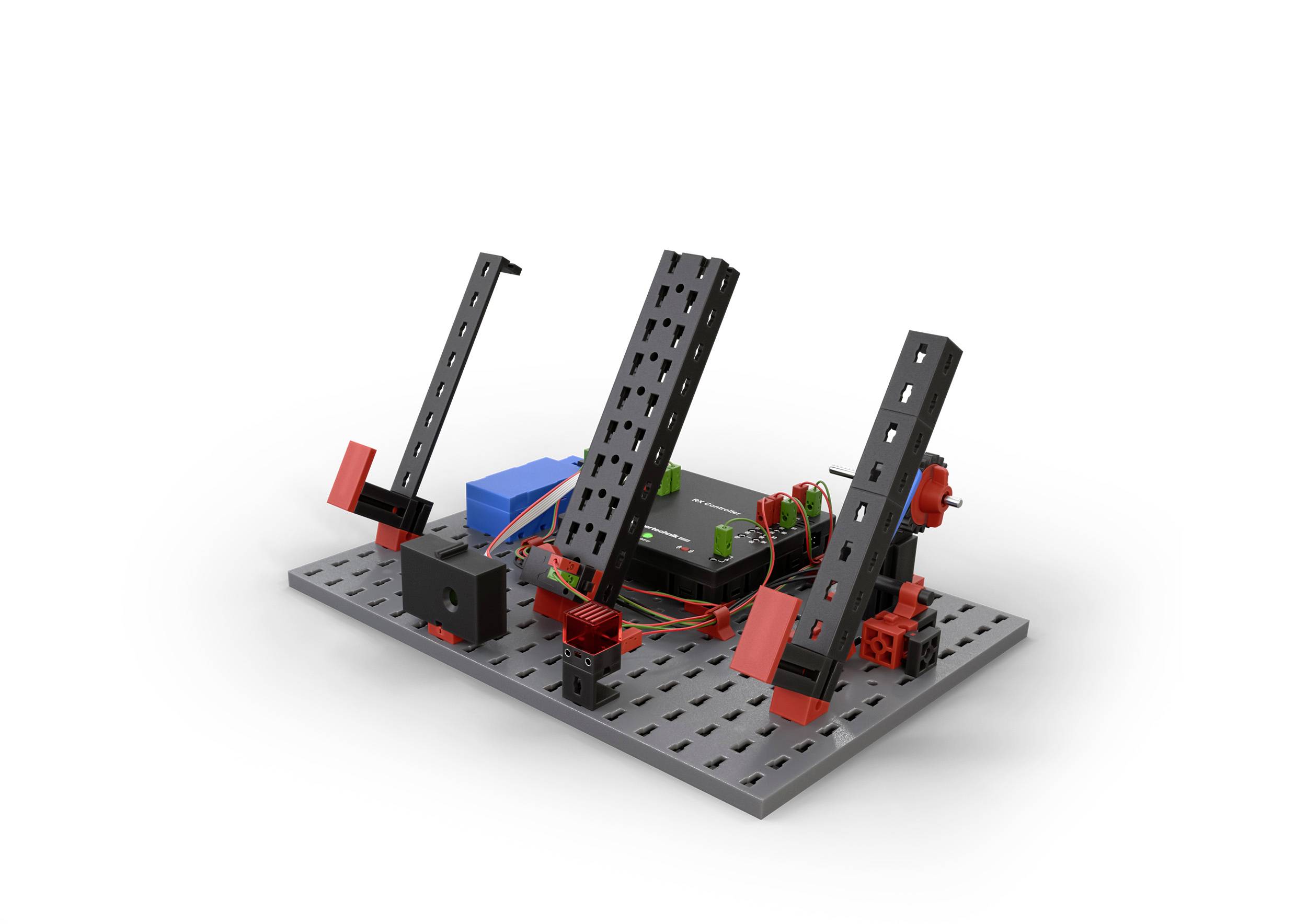 Zestaw konstruktorski z czarnymi i czerwonymi elementami na szarej podstawie. Zawiera silniki i części elektroniczne do budowy różnych konstrukcji.