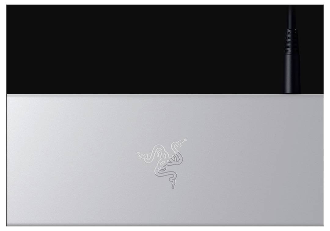 Srebrna, prostokątna powierzchnia z symbolem pośrodku i przewodem w górnym prawym rogu.