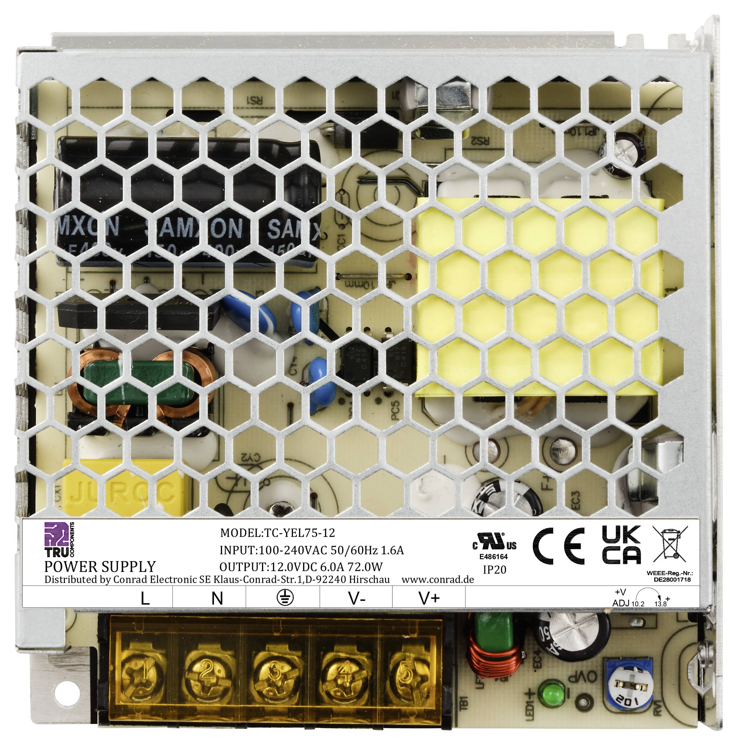 Otwarta obudowa zasilacza komputerowego z siateczkową osłoną ujawnia elektroniczne komponenty, takie jak kondensatory i transformatory. Widoczne jest oznaczenie CE.