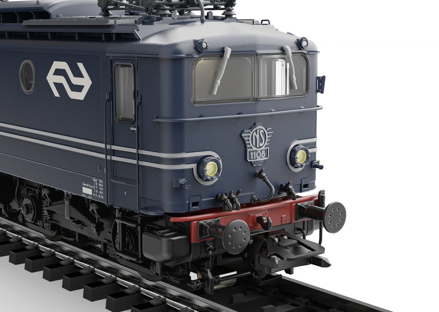 Ciemnoniebieska lokomotywa holenderskich kolei na torach. Charakterystyczne logo i widoczne czerwono-czarne szczegóły na czole pojazdu.