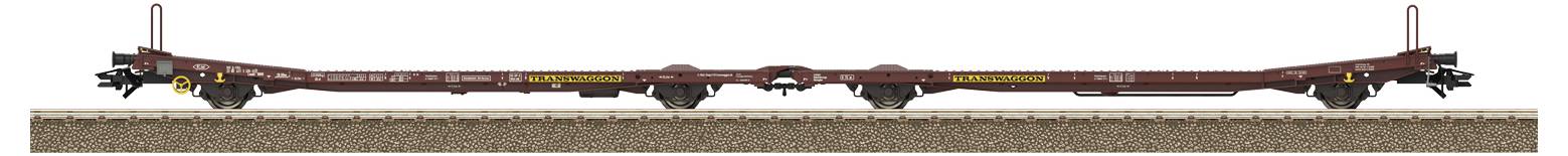 Pusty, długi wagon platformowy na torach, używany do transportu dużych lub gabarytonwych ładunków.
