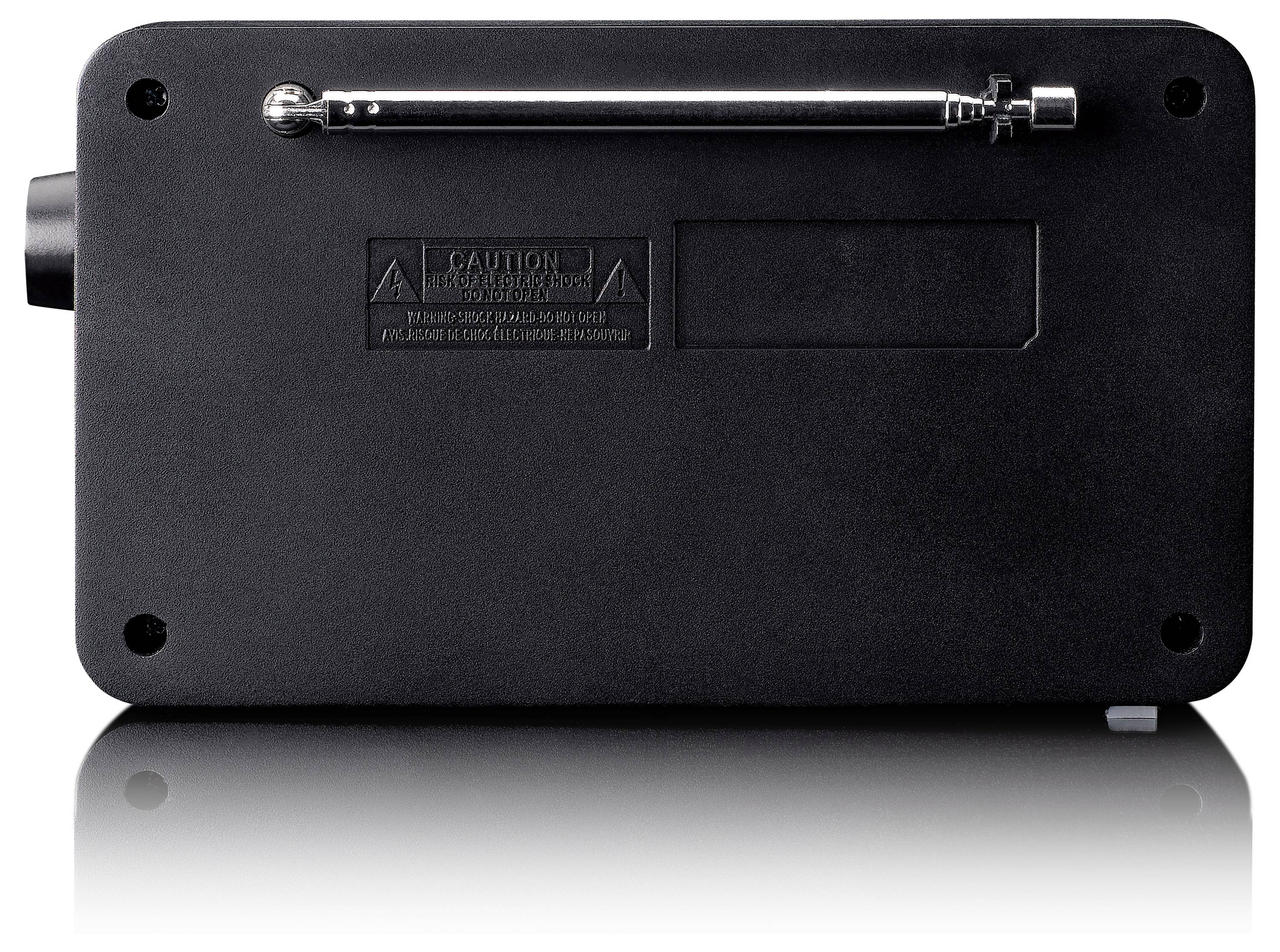 Tylna strona czarnego urządzenia z wysuwaną anteną oraz ostrzeżeniem na gładkiej powierzchni.