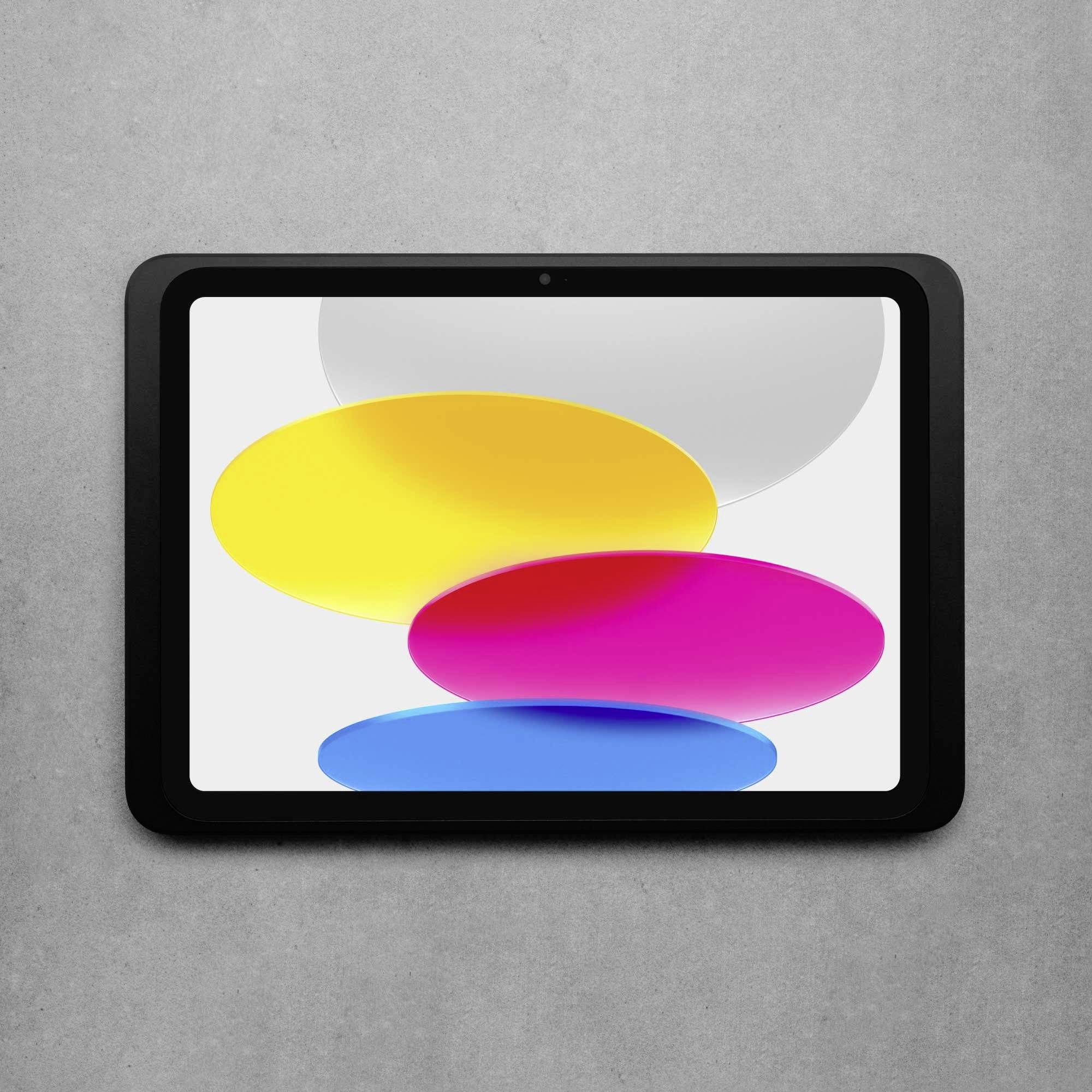 Tablet z szarą ramką wyświetla grafikę z nakładającymi się, kolorowymi owalami w kolorach żółtym, różowym i niebieskim na szarym tle.