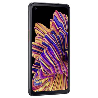 Smartfon z żywym, abstrakcyjnym tłem ekranu w kontrastowych kolorach.
