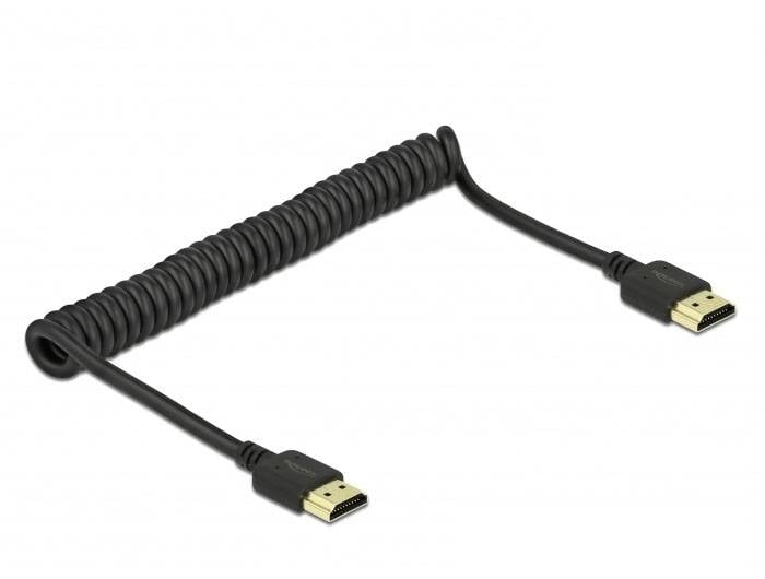 Spiralny kabel HDMI z wtyczkami na obu końcach, przeznaczony do elastycznego podłączania urządzeń elektronicznych.