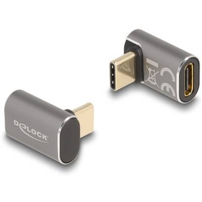Dwa adaptery USB-C, które są zagięte pod kątem 90 stopni, w srebrnym designie. Marka 'Delock' widoczna na jednym z adapterów.