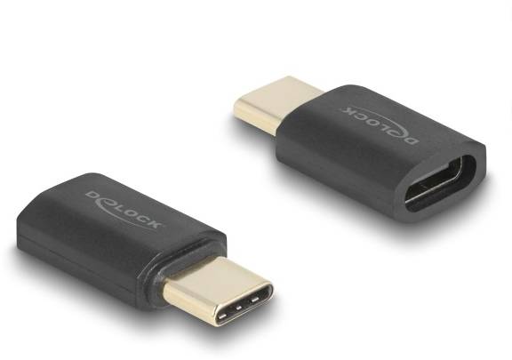 Dwa czarne adaptery USB-C z logo 'Delock', przedstawiające odpowiednio wtyczkę i gniazdo. Są one sfotografowane na białym tle.