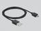 Czarny kabel USB na micro USB, leżący na szarej powierzchni, z widocznymi obiema wtyczkami.