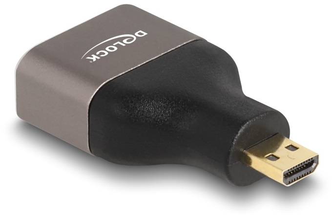 Adapter z pozłacanym złączem HDMI w kształcie prostokąta, z nazwą marki 'Delock' na górnej powierzchni.