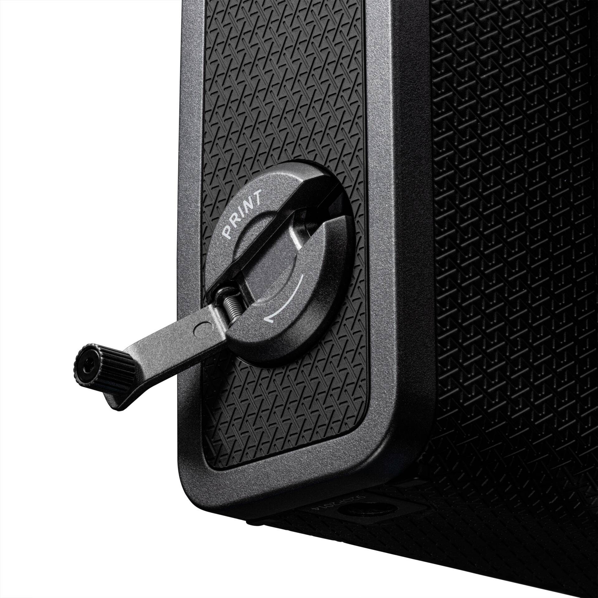 Widok z boku czarnej, strukturalnej kamery z obrotową dźwignią oznaczoną napisem 'PRINT'.