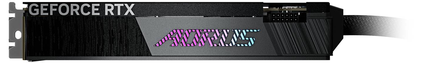 Karta graficzna 'Geforce RTX' z podświetlonym napisem 'AORUS', widok z boku, pokazująca sloty i złącza.