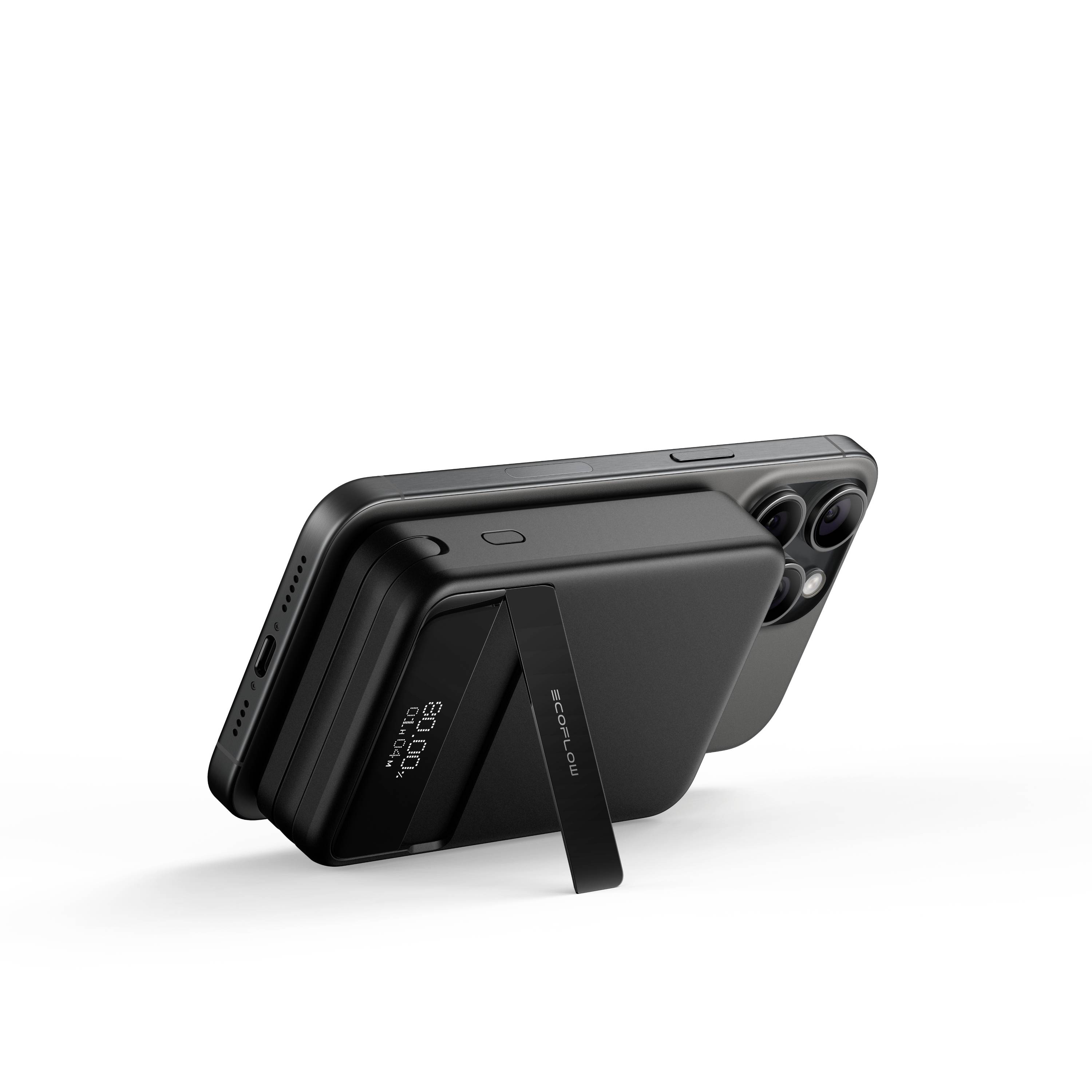 Smartfon i przenośny powerbank z zintegrowaną podstawką stoją obok siebie. Powerbank wyświetla swoją aktualną pojemność.