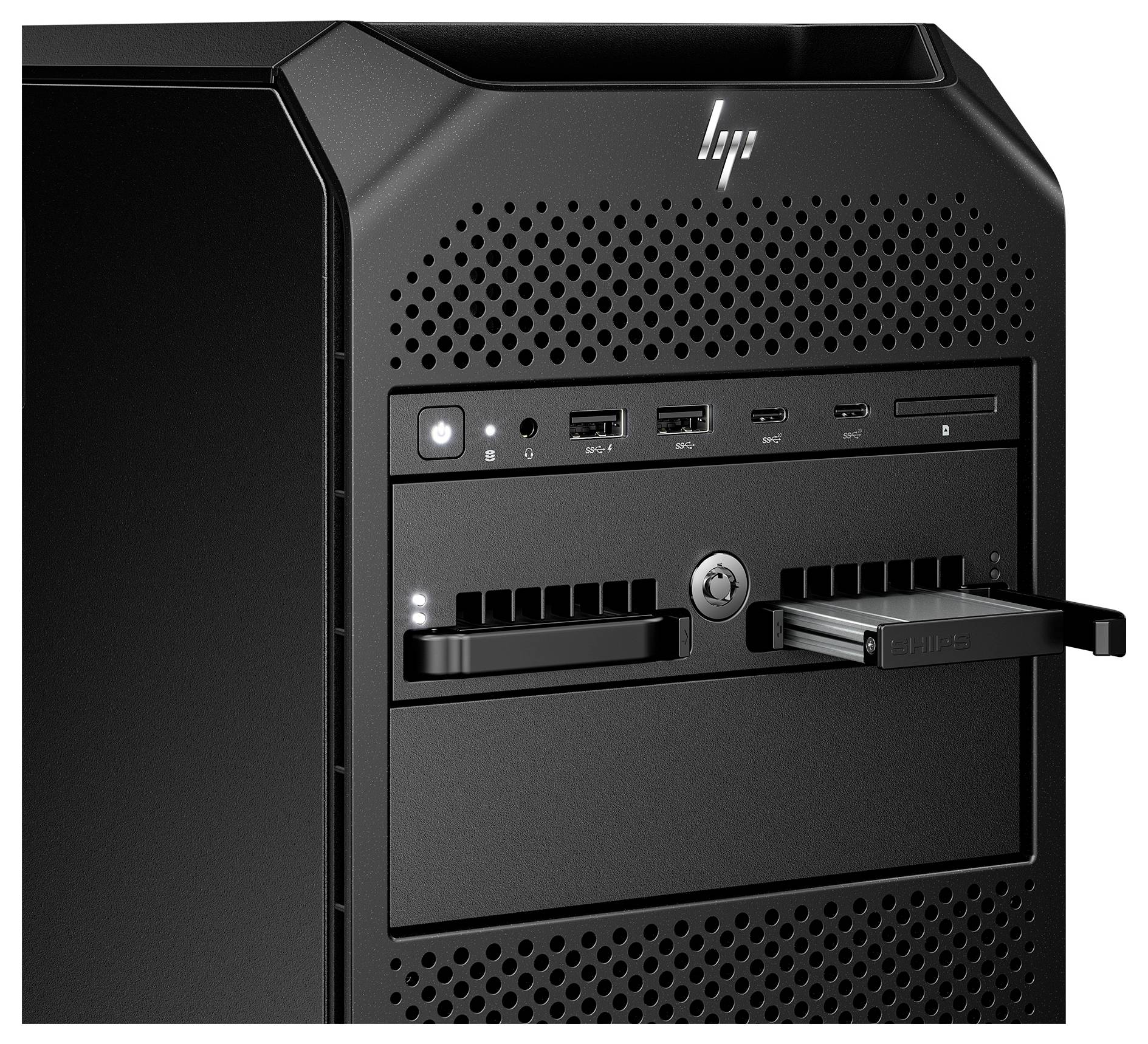 Czarny komputer stojący w obudowie z wieloma portami USB oraz kieszeniami na dyski twarde z przodu.