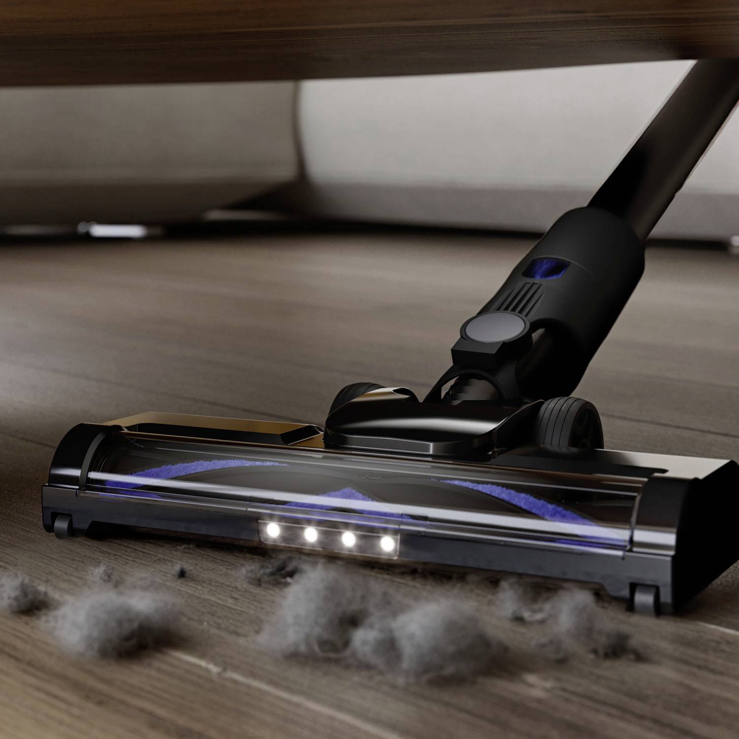 Odkurzacz czyści podłogę, ssąc kurz i brud spod mebla. Kilka kłaczków kurzu jest widocznych.