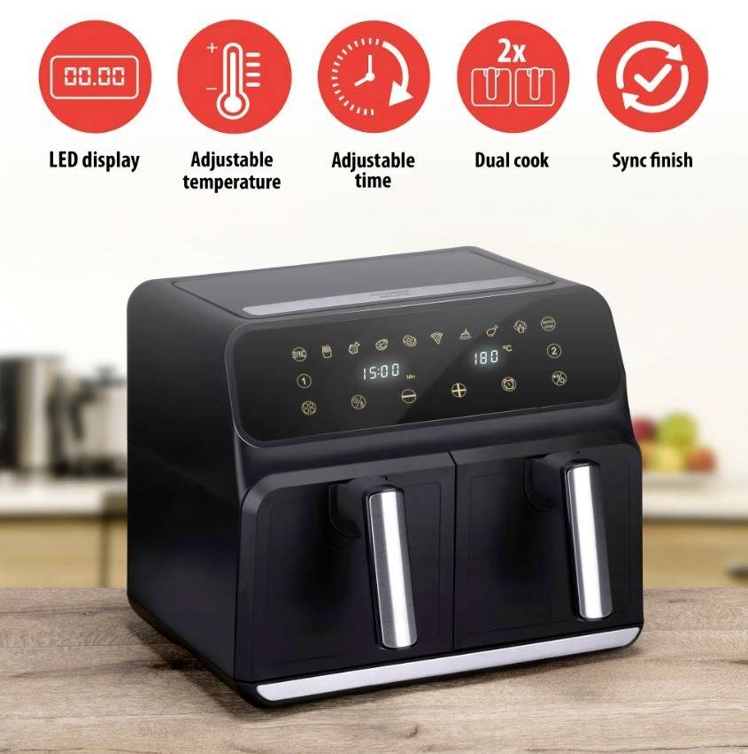 Czarny airfryer z dwoma komorami stoi na blacie kuchennym. Na górze widoczne są symbole wyświetlacza LED, ustawień temperatury i czasu, podwójnego trybu gotowania oraz jednoczesnego zakończenia procesu.