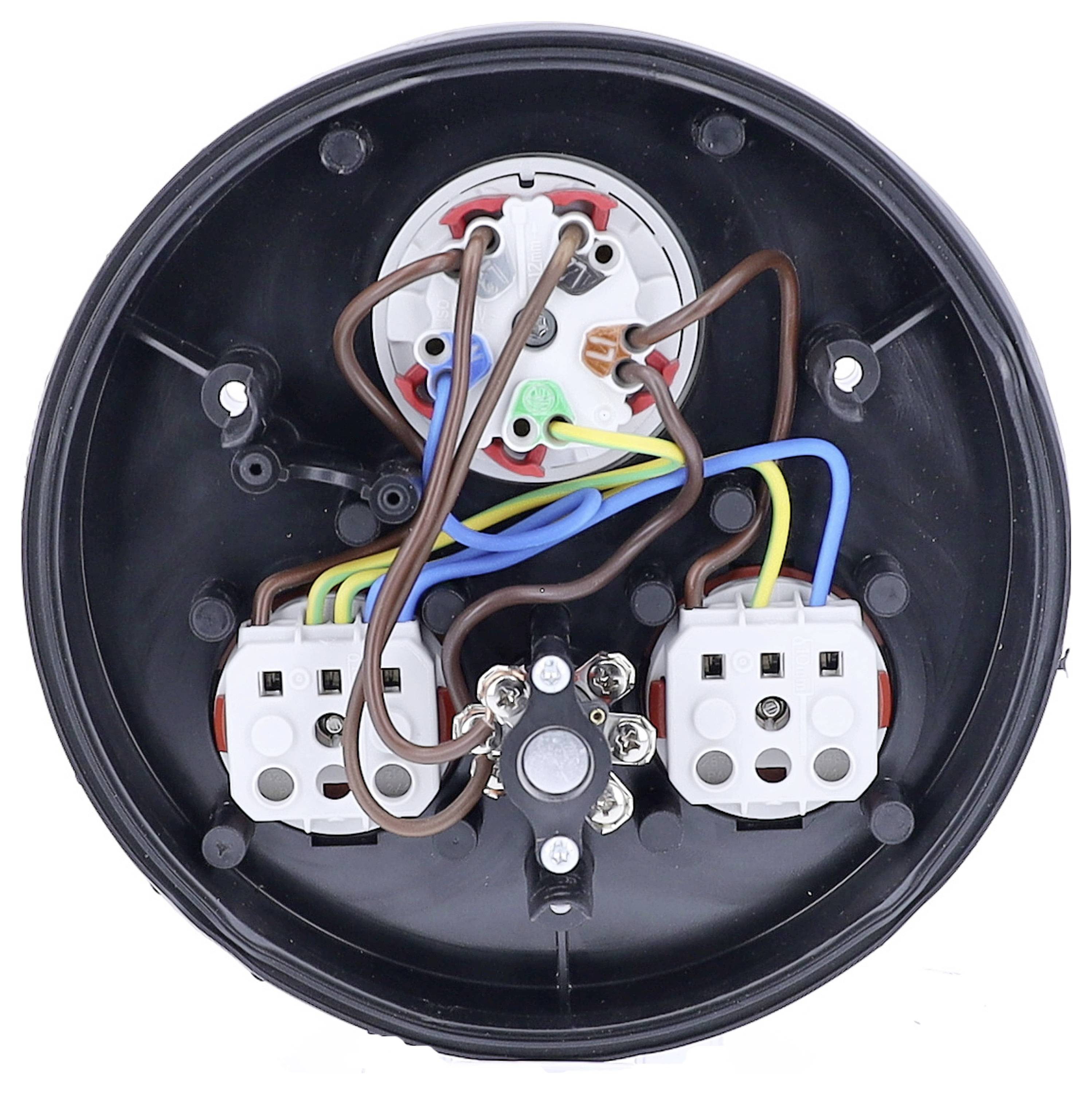 Widok z tyłu okrągłego złącza elektrycznego. Różnokolorowe przewody są przymocowane do kilku styków wewnątrz obudowy.