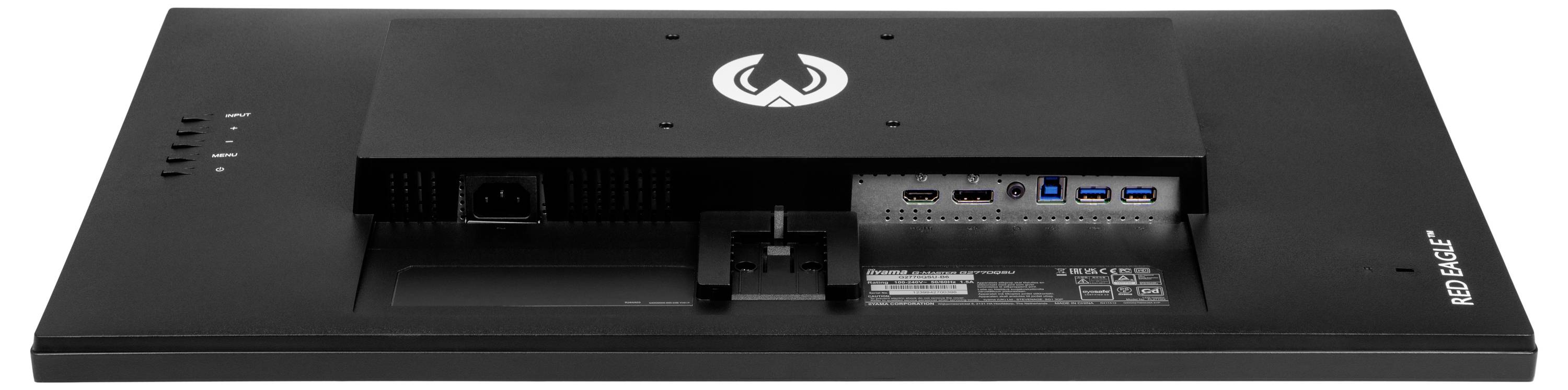 Tylna strona urządzenia elektronicznego z różnymi gniazdami przyłączeniowymi i symbolem pośrodku.