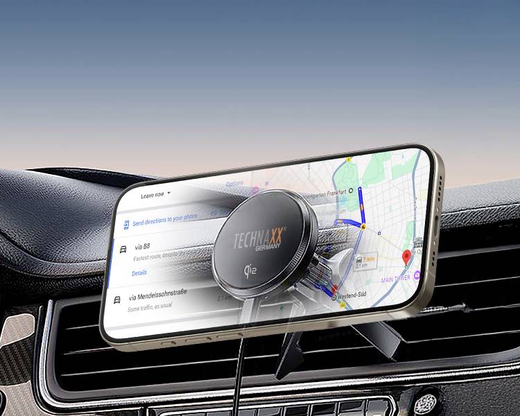 Smartfon z włączoną aplikacją nawigacyjną wyświetla trasę na mapie. Jest zamocowany w uchwycie samochodowym.