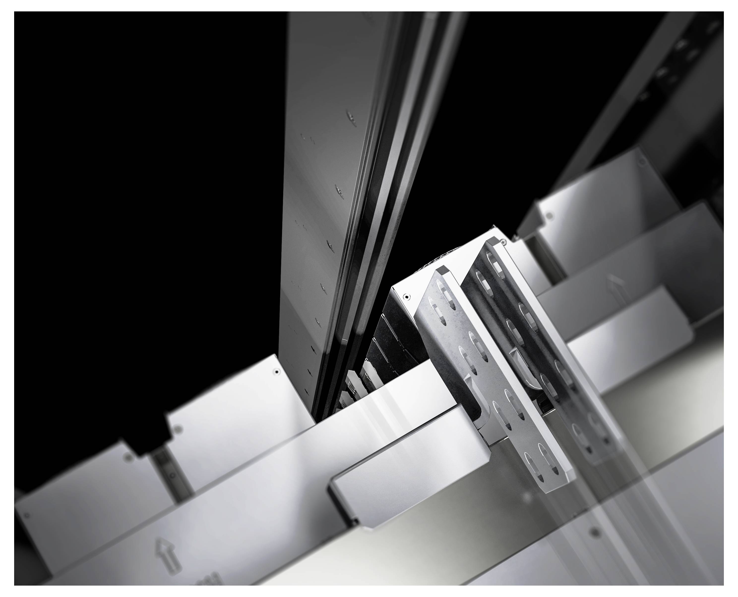 Mechaniczne elementy modułowego systemu regałowego, wykonane głównie z metalu, w zbliżeniu ukazującym strukturę i budowę.