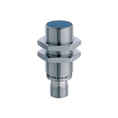 Cylindryczny metalowy cylinder z gwintem, prawdopodobnie czujnik lub element, na neutralnym tle.