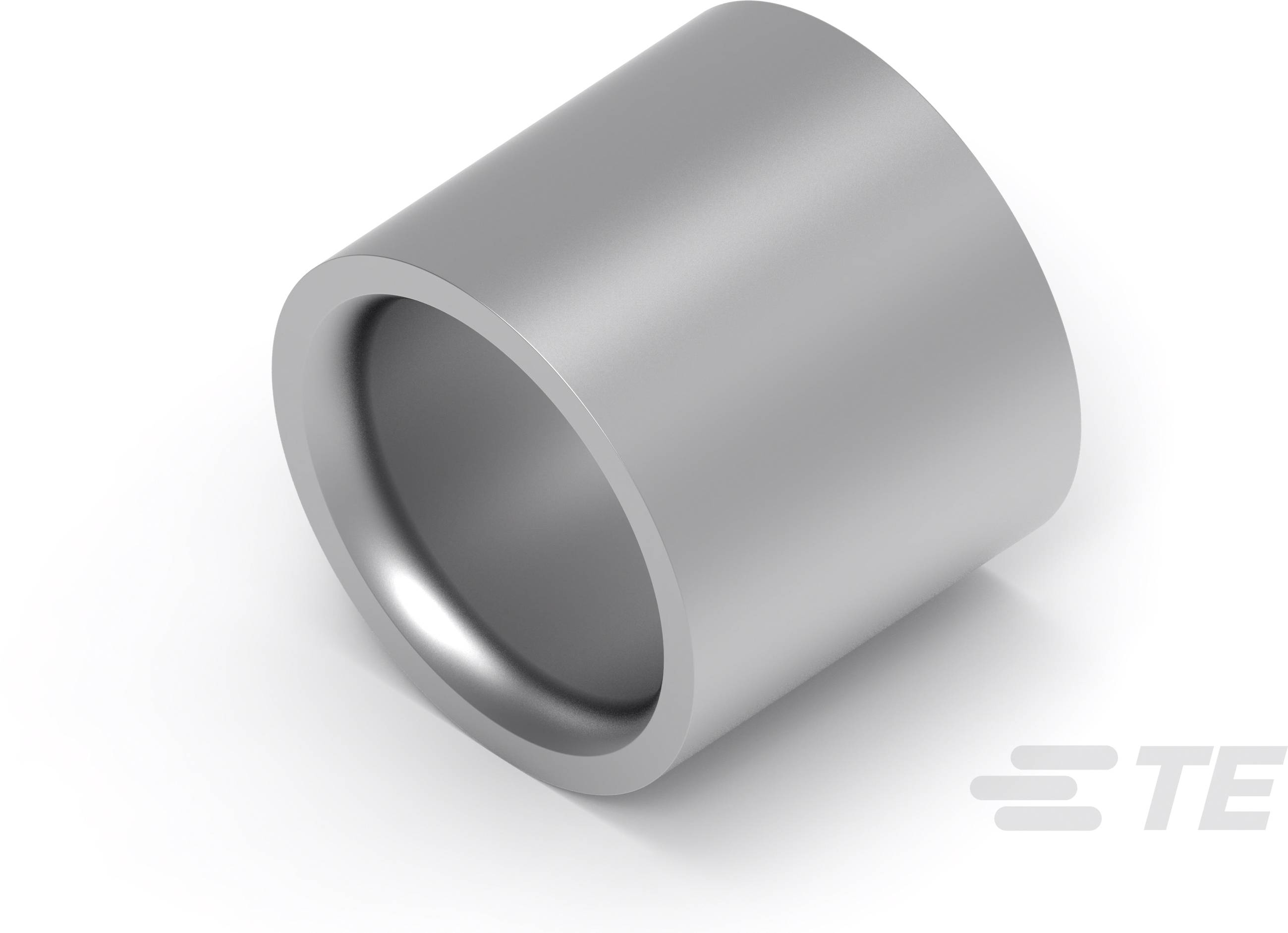 Cylindryczny srebrny kawałek metalu, prawdopodobnie wtyczka lub element techniczny, leży na białej powierzchni.