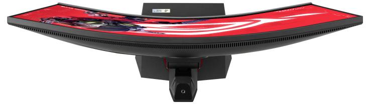 Zakrzywiony ekran komputerowy z jaskrawo czerwonym tłem prezentuje płaski, nowoczesny design. Widok z góry.