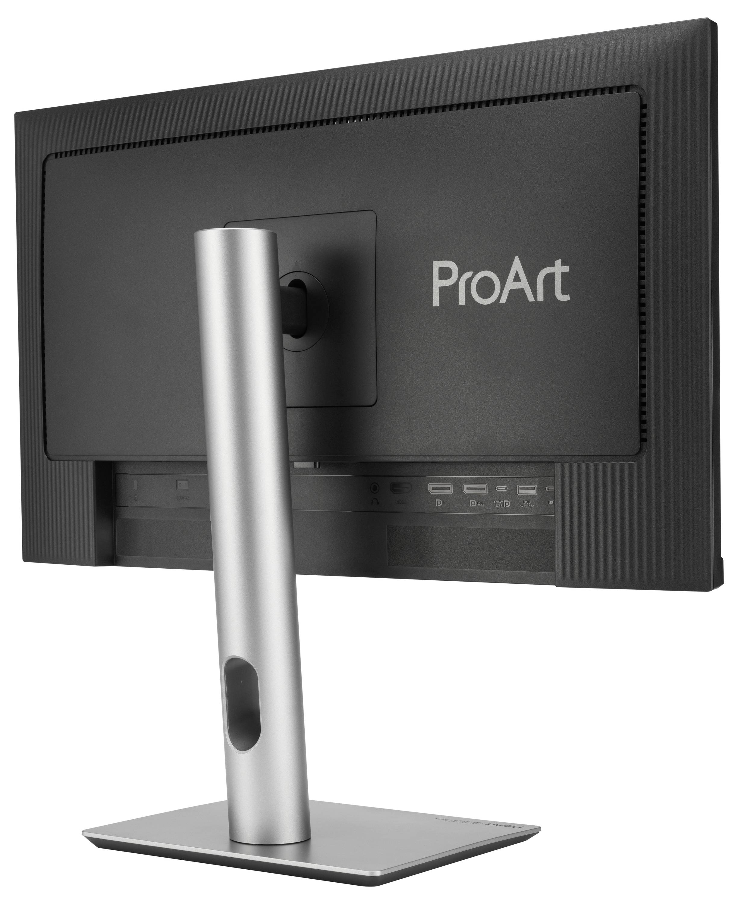 Monitor z srebrną podstawą, z tyłu logo 'ProArt'. Widoczny jest obszar podłączeń monitora.