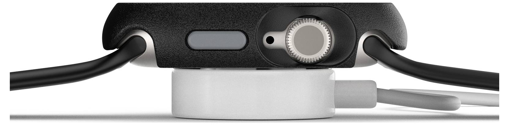 Smartwatch jest pokazana z boku na ładowarce. Widoczna jest obudowa oraz jeden przycisk. Kable łączą zegarek ze źródłem zasilania.