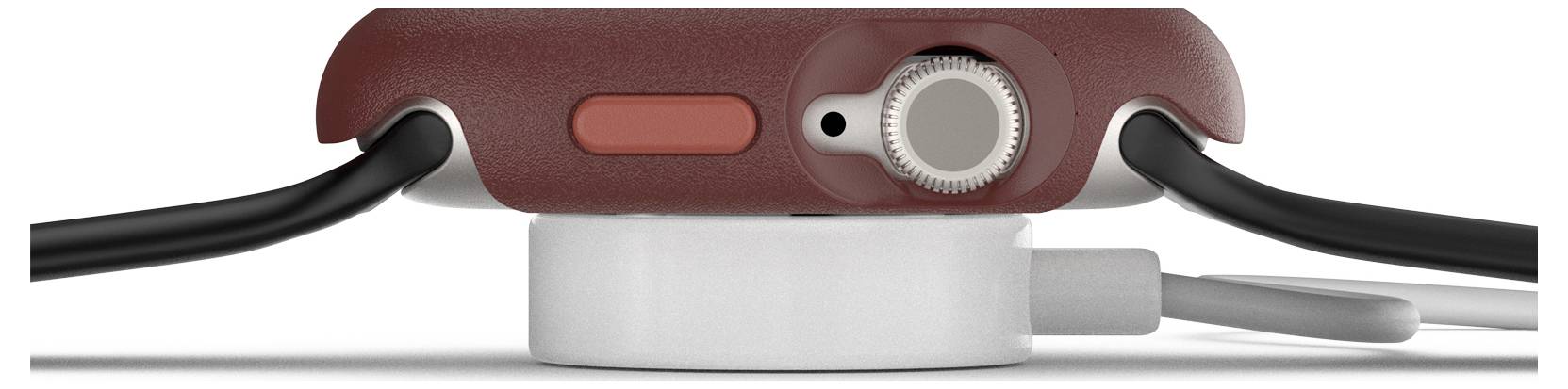 Smartwatch w widoku bocznym spoczywa na ładowarce. Ma czerwoną obudowę oraz widoczne przyciski i koronkę.