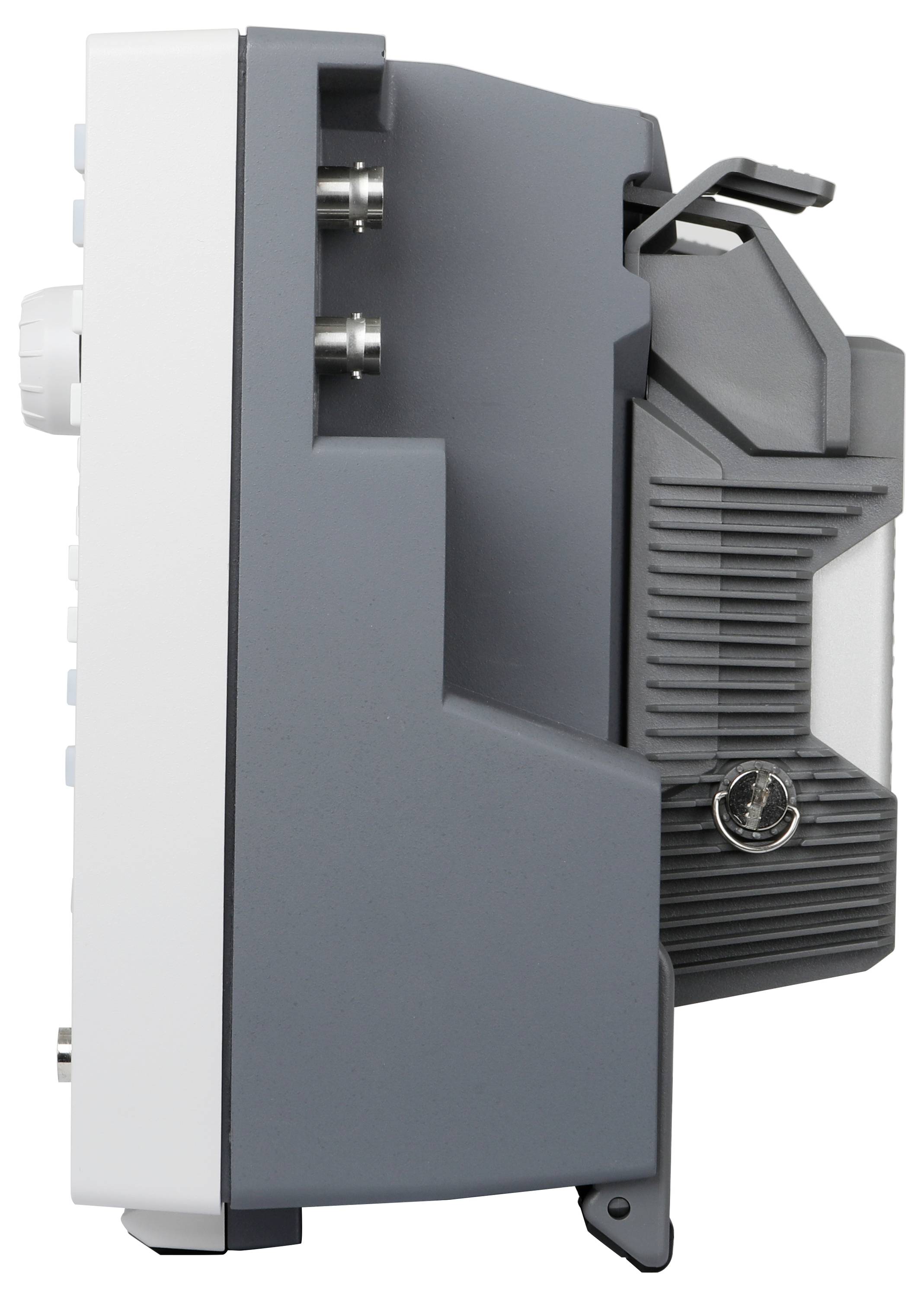 Widok z boku szaro-białego urządzenia elektronicznego z wieloma portami i uchwytem do przenoszenia.