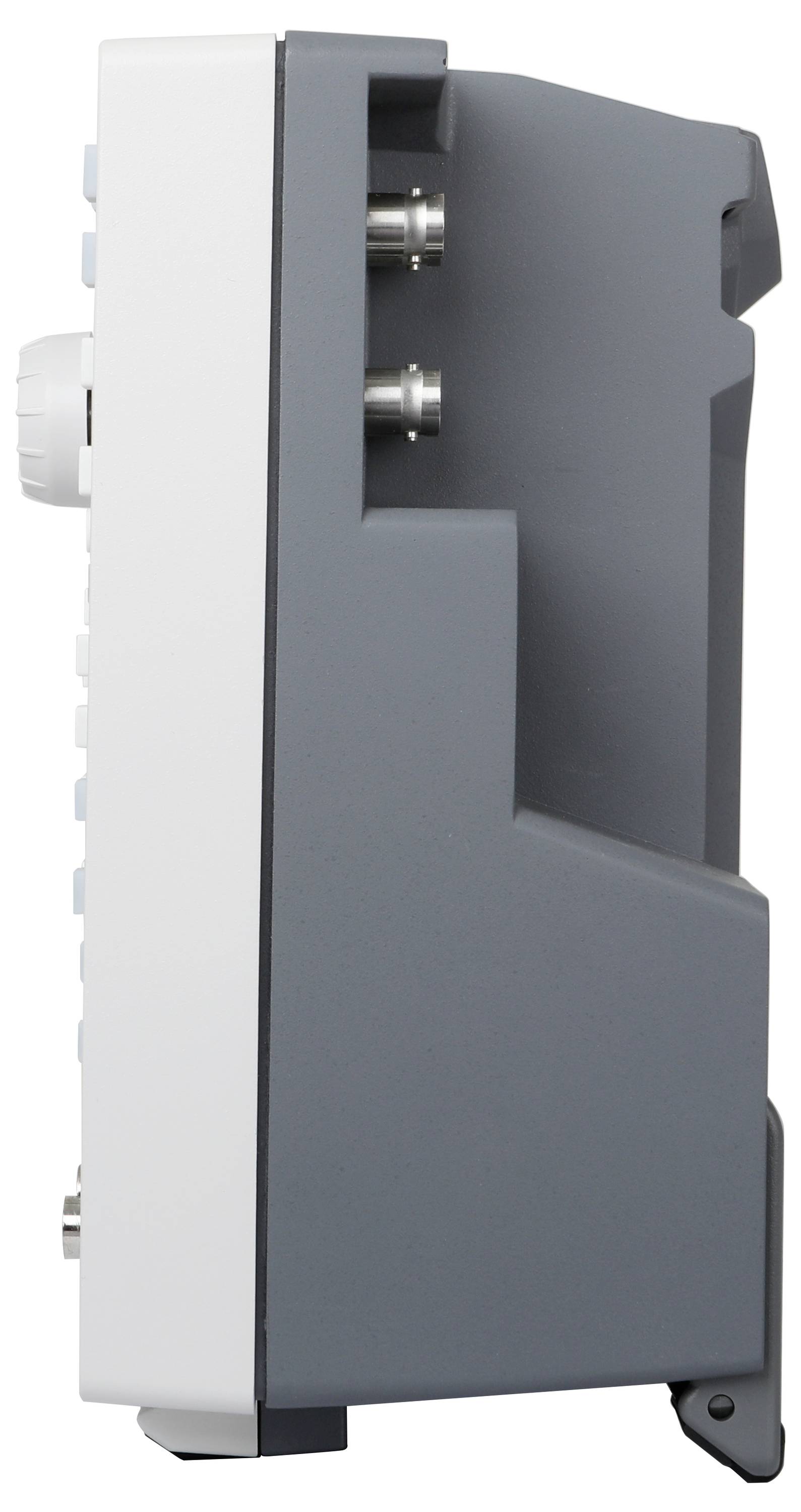 Widok z boku szarego, prostokątnego urządzenia elektronicznego z wieloma przyciskami i złączami.