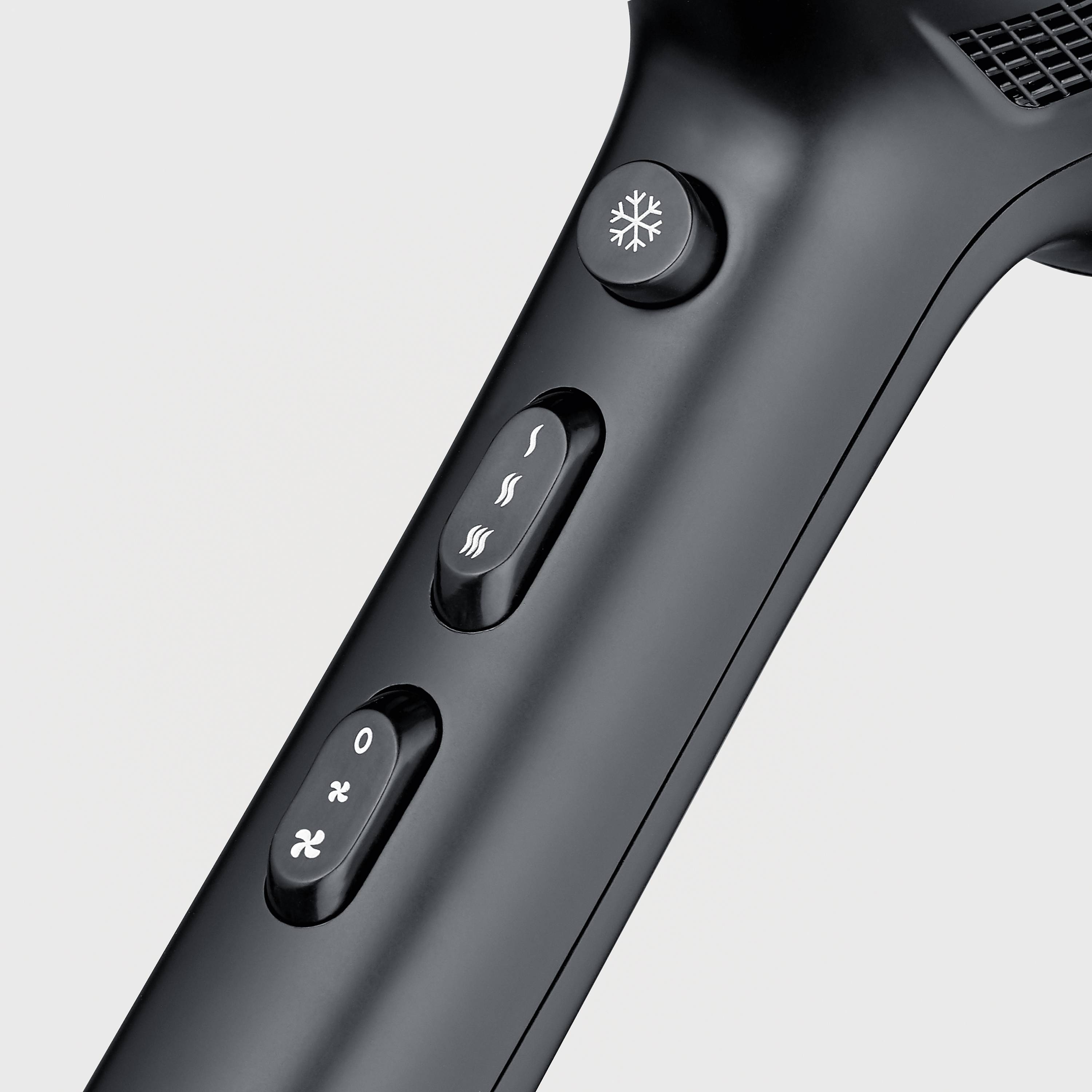 'Czarna rękojeść suszarki z trzema przyciskami: chłodzenie, ustawienie temperatury, intensywność nadmuchu.'